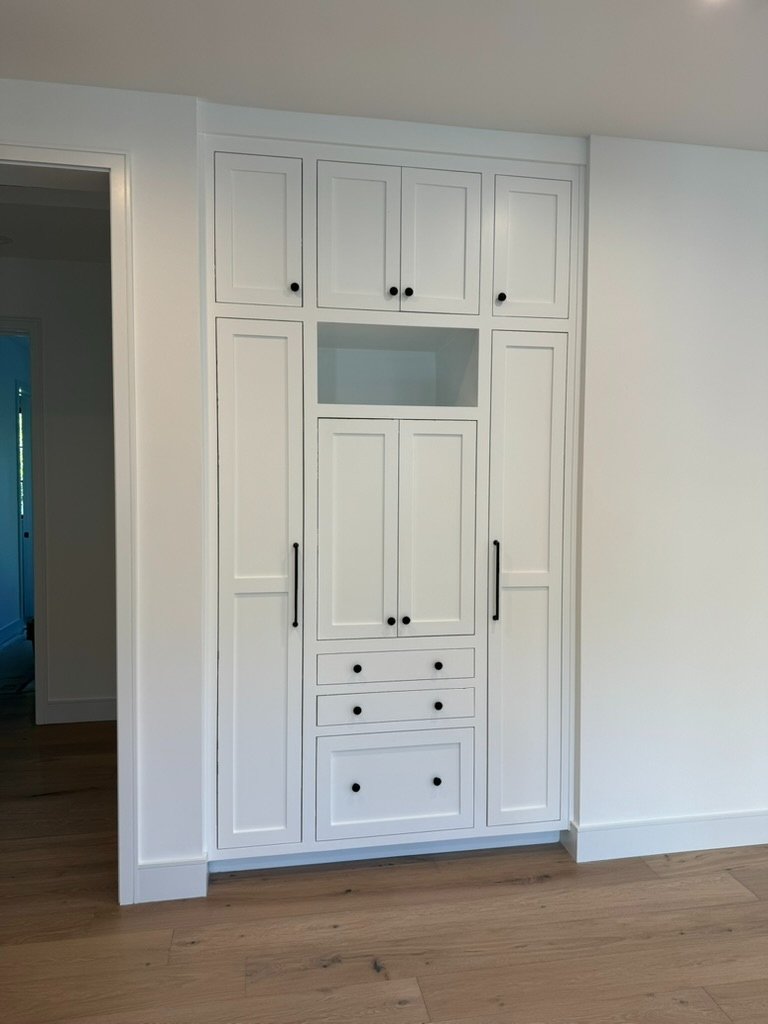 Crisp white built-in cabinet after repaint